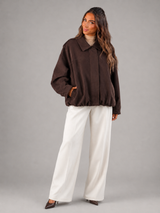 Faux suede oversized shirt jacket – fabric texture close-up – Nude & Nero
