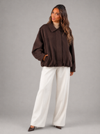 Faux suede oversized shirt jacket – fabric texture close-up – Nude & Nero