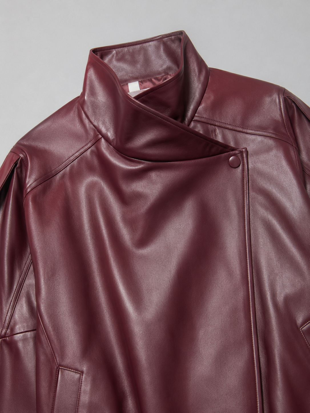 Faux leather bomber jacket – side view – Nude & Nero